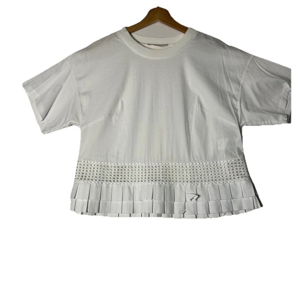 Capucci women's blouse 
Elegant White Eyelet Hem Top